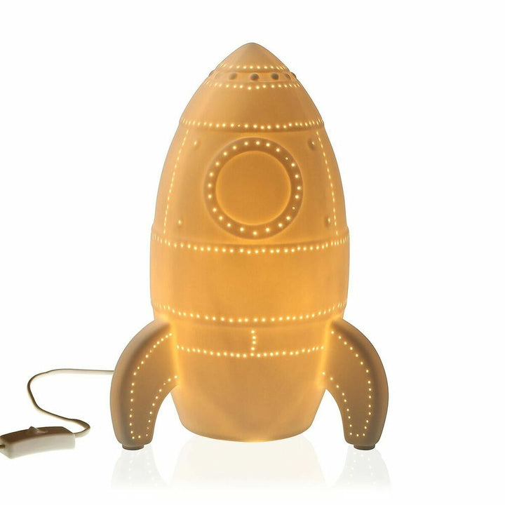 Versa Tischlampe in Raketenform aus Porzellan mit dekorativen Lichtpunkten.