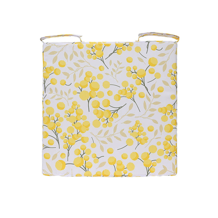 Decoris Kissen mit gelbem Blumenmuster und praktischen Befestigungsbändern.