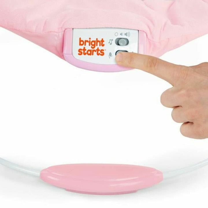 Rosa Bright Starts Baby-Liegestuhl mit Sound- und Vibrationsfunktionen.