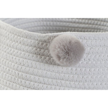 Nahaufnahme eines grauen DKD Home Decor Korbs mit Bommel - homely Family Shop