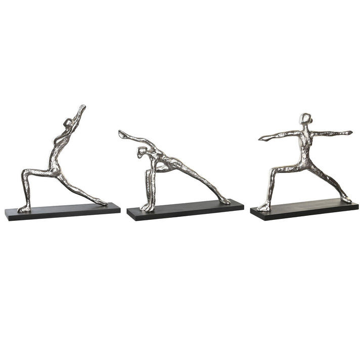 Silberne Yoga Deko-Figuren auf schwarzen Sockeln. Figuren zeigen indische Yoga-Posen.
