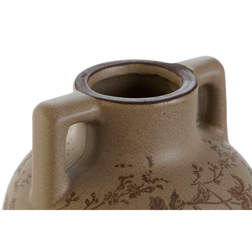 Nahaufnahme: Braune Steingut Vase mit Pflanzenblatt Design und Henkel.