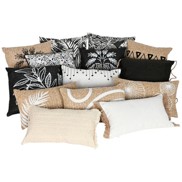 Vielfalt an Home ESPRIT Kissen in Schwarz und Natur mit verschiedenen Mustern und Texturen.