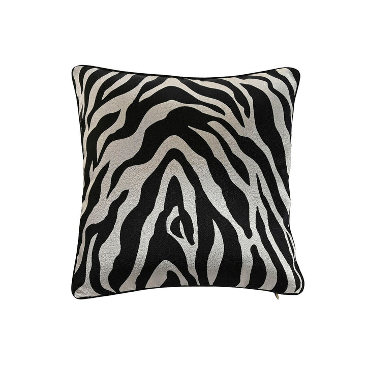 Dekoratives Kissen Home ESPRIT mit auffälligem Zebra-Muster in Schwarz und Gold.