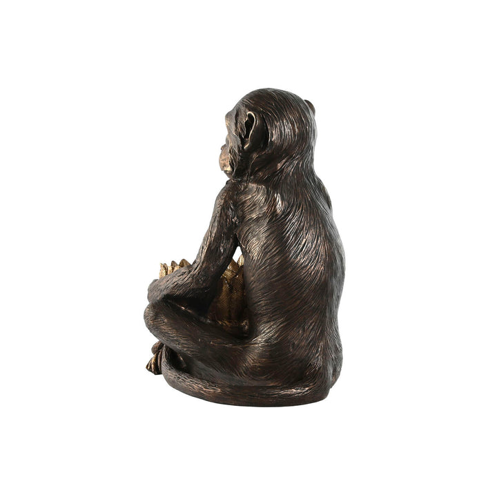 Dunkelbraune ESPRIT Home Deko-Figur eines Affen mit goldenen Akzenten.