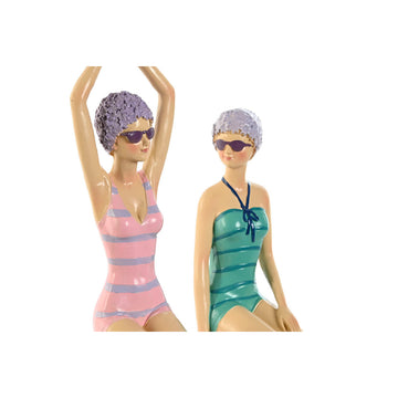 Türkis-lila Deko-Figuren im Retro-Look. Mediterraner Stil mit gestreiften Badeanzügen und Sonnenbrillen.
