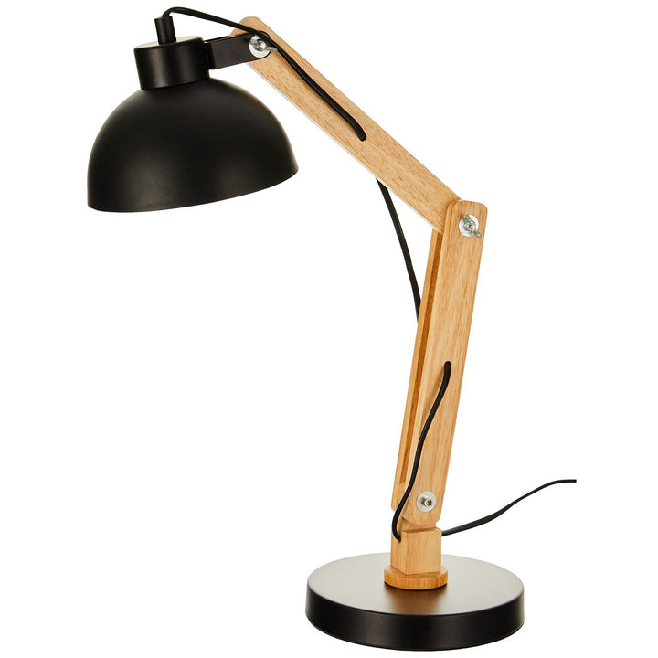 Schwarze Flexo-/Tischleuchte mit Holzarm und Metallsockel. Die Lampe ist höhenverstellbar.