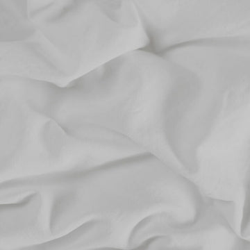 Nahaufnahme: Perlefarbenes Oberlaken für Einzelmatratze mit weicher Textur.