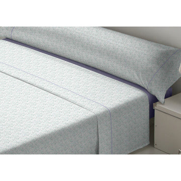 Tejidos Reina King Size Bettwäsche-Set mit zartem Muster und lila Akzent.
