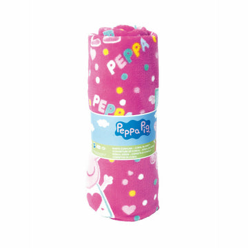 Gerollte, rosa Peppa Pig Decke mit Herzen und bunten Punkten. Coral Decke.
