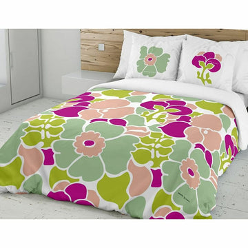 Bettdeckenbezug mit Blumenmuster. Grünes und pinkes Blumendesign auf dem Bettbezug.
