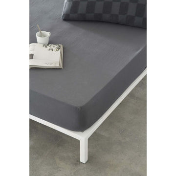 Dunkelgraues Spannbetttuch Naturals ELBA 135x200. Elegante Textur und tiefe Farbe.