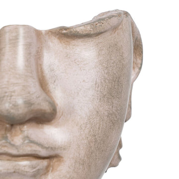 Nahaufnahme der beigen Deko-Figur Gesicht. Stilvolle Dekoration mit besonderer Form.
