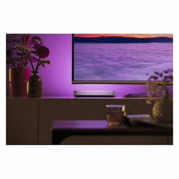 Weiße Philips Play Tischlampe aus Kunststoff mit lila Akzentbeleuchtung für ein modernes Ambiente.