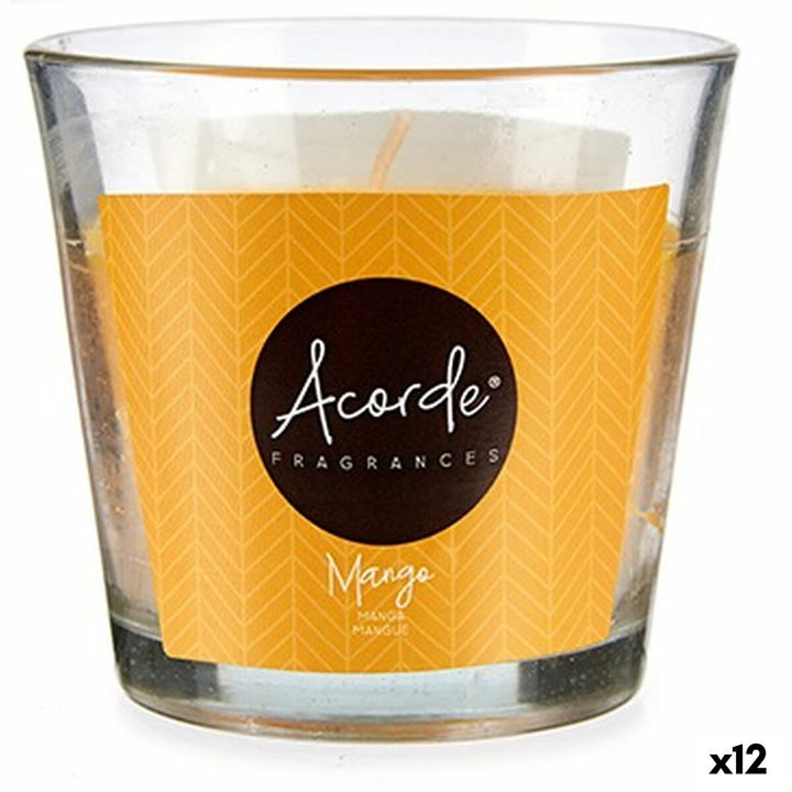 Duftkerze Acorde Mango im Glas. Gelbes Etikett mit Chevron-Muster und Markenlogo.