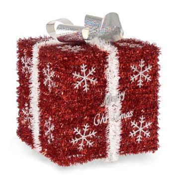 Rote Geschenkbox mit weißen Schneeflocken und silberner Schleife.