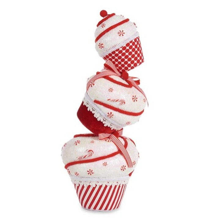 Deko-Figur Turm Kuchen, weiß und rot, mit Streifen und Schneeflocken verziert.